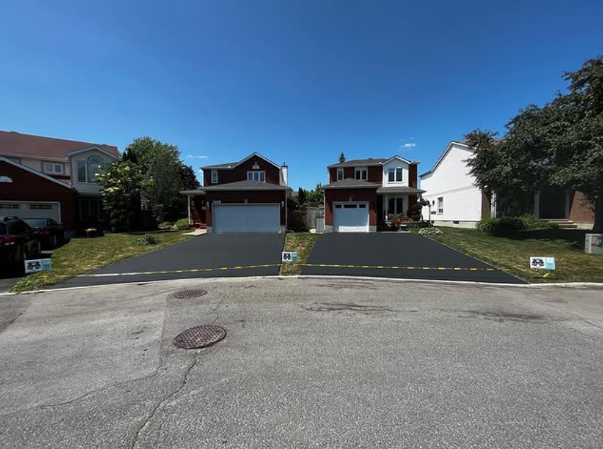Two neighbouring driveways sealed by Seal Bros